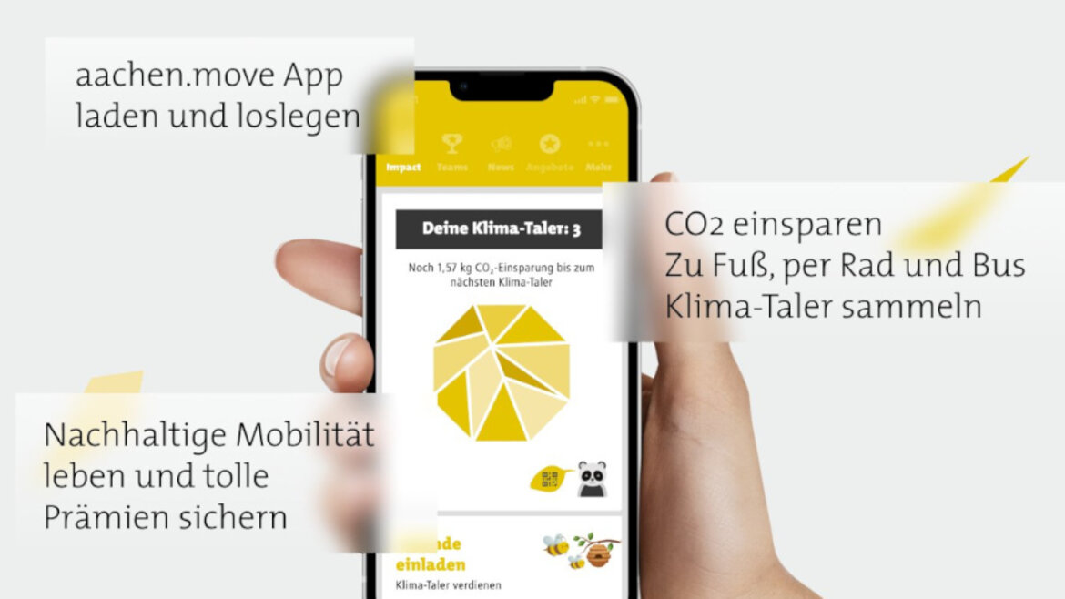Hand hält Handy, auf dem die "aachen.move"-App angezeigt wird